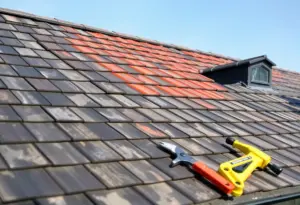 A beautifully finished roof with different roofing materials and tools